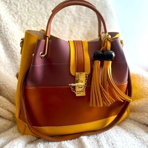 Color block, tasseled bag